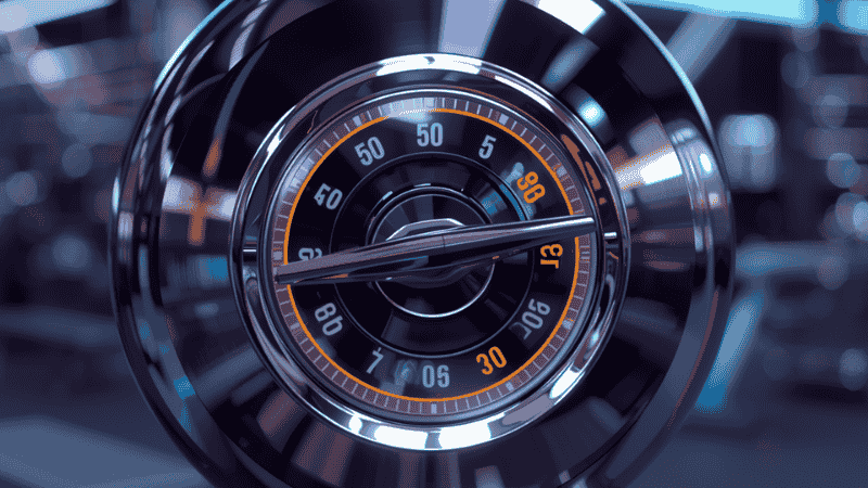 A close-up shot of the adjustable dumbbell's rotating dial mechanism, clearly displaying the weight adjustment interface ranging from 5 to 50 pounds.