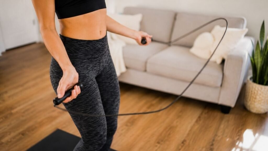 Close-up of proper jump rope technique showing wrist rotation with elbows close to body